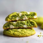 Stack of three Chewy Matcha White Chocolate Cookies, showing the vibrant green interior and melted white chocolate chips.