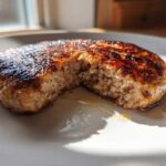 Close-up of a perfectly cooked Air Fryer Turkey Burger, showing a juicy interior and caramelized exterior.