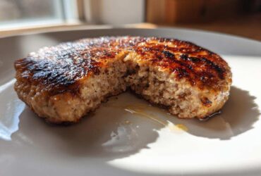 Close-up of a perfectly cooked Air Fryer Turkey Burger, showing a juicy interior and caramelized exterior.