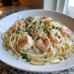 Close-up of Garlic Butter Shrimp Pasta with Cream Sauce, topped with parsley.