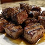 Close-up of perfectly cooked Garlic Butter Steak Bites showing a juicy, medium-rare center.