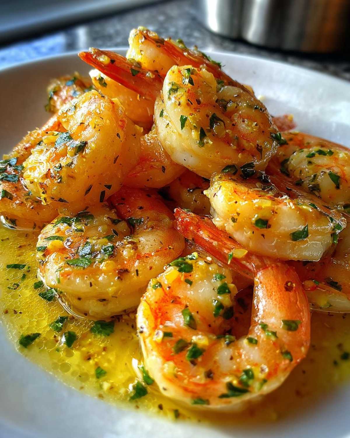 Close-up of succulent shrimp coated in a rich lemon butter sauce with garlic and parsley, highlighting the Lemon Butter Shrimp with Garlic Flavor.