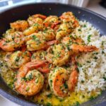Close-up of juicy Garlic Butter Shrimp with Rice Skillet, coated in garlic butter sauce and fresh parsley.